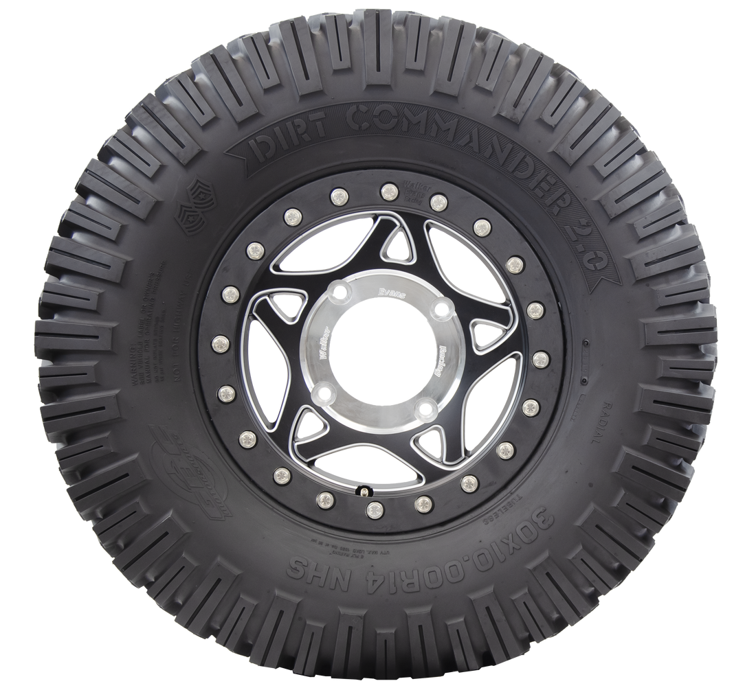 Sideview of Dirt Commander 2.0 ATV/UTV tire, displaying the rugged elongated sidewall lugs, designed for extra biting edges. These lugs provide greater reliability on challenging trails and obstacles and offer superior sidewall protection against punctures and damages.