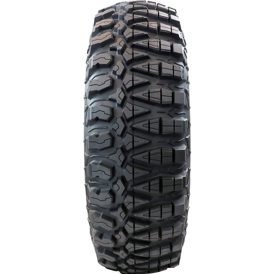 Full frontal view of Terra Master ATV/UTV tire, displaying its unique two distinct tread patterns. The user can alternate sides for improved traction in either hard or soft-to-intermediate terrains, offering versatile performance for diverse off-road experiences.