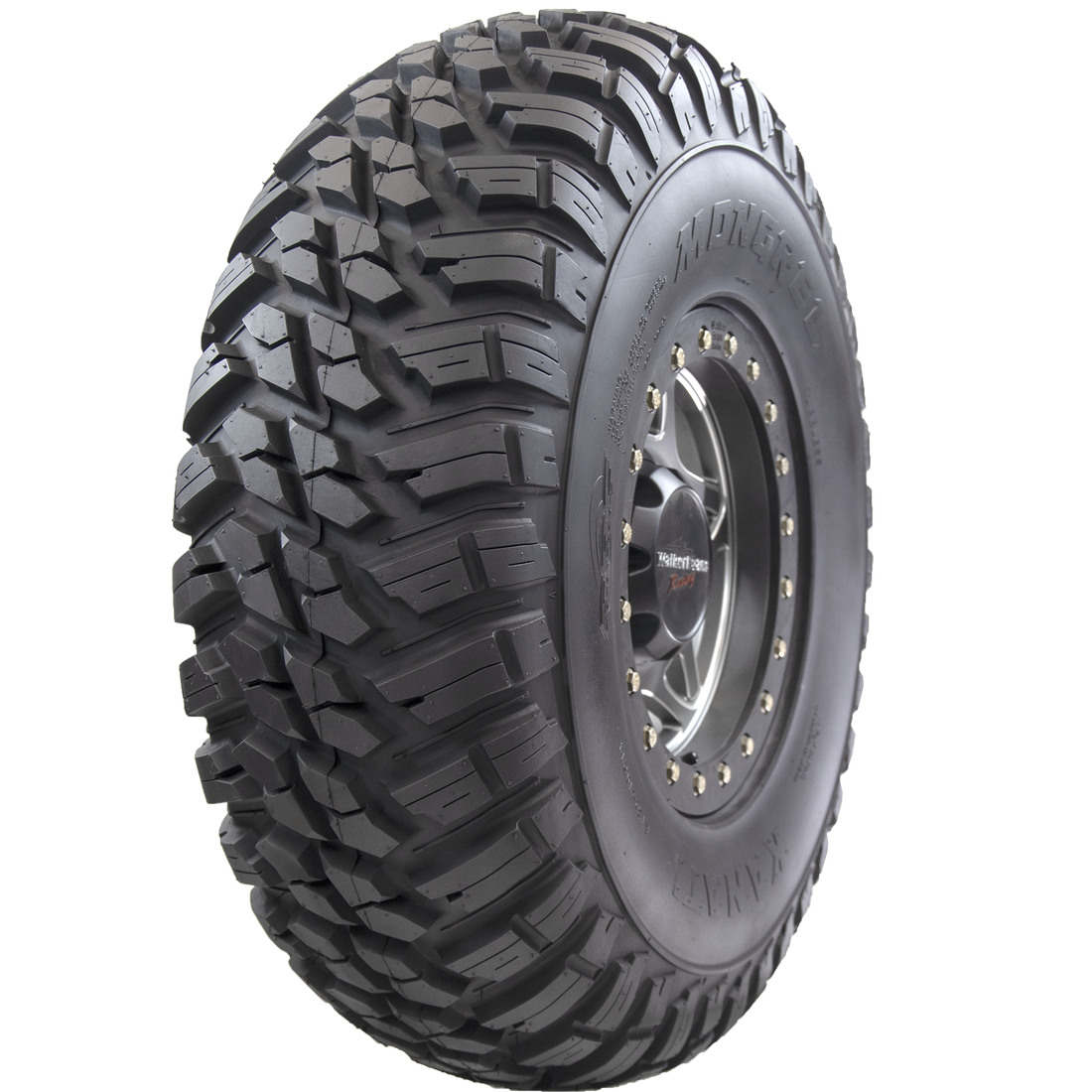 Angle view of Mongrel ATV/UTV tire, showcasing the robust tread, partial sidewall, and rim. This tire is built to handle high horsepower and speed capabilities of modern UTVs and SxS.