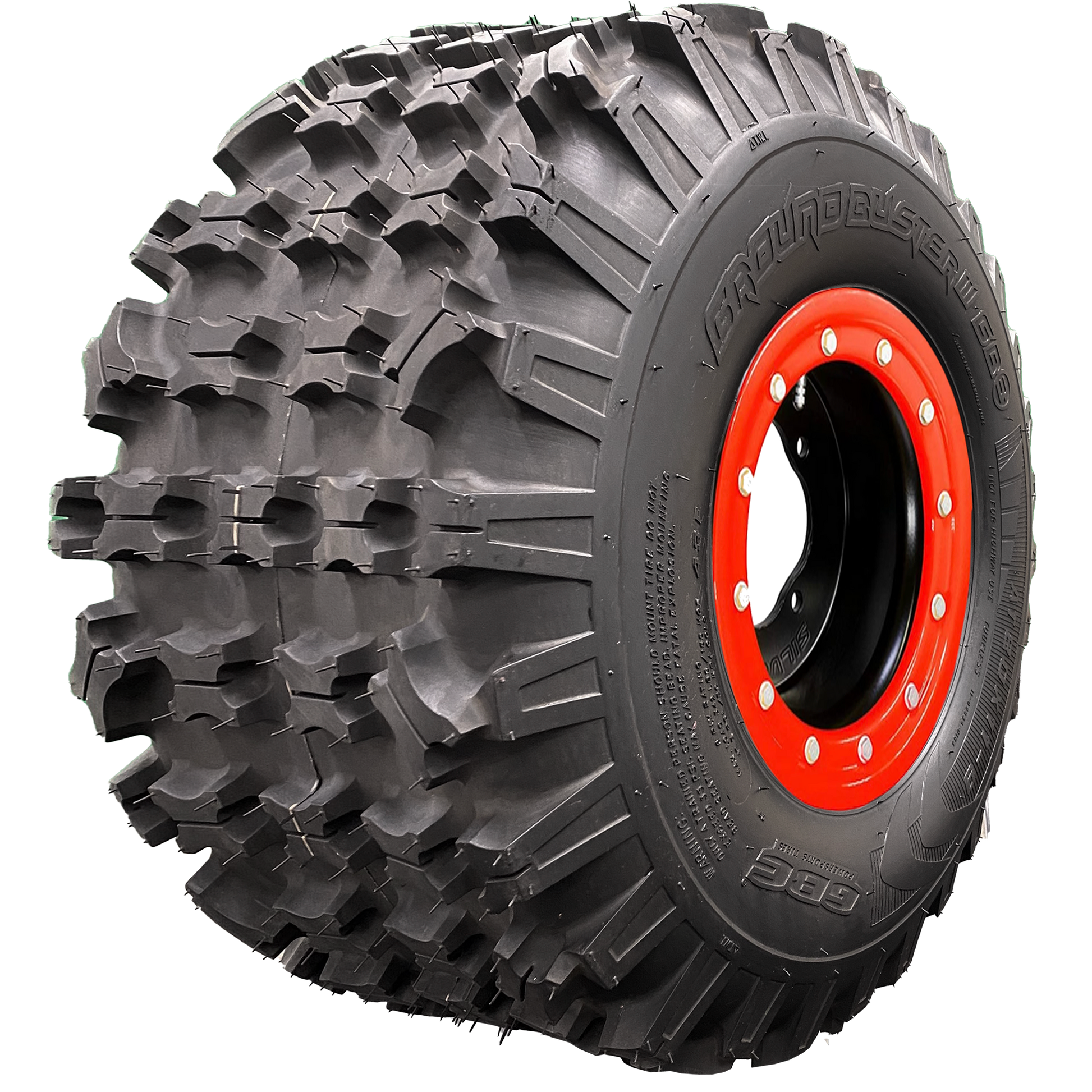 Angle view of Ground Buster 3 ATV tire, exhibiting the tread, a section of the sidewall, and the rim. This image reveals the tire's non-directional sipped X-knob tread pattern for maximum flexibility. The hefty sidewall lugs ensure optimum cornering traction and control, perfect for intermediate to hard terrain racing.