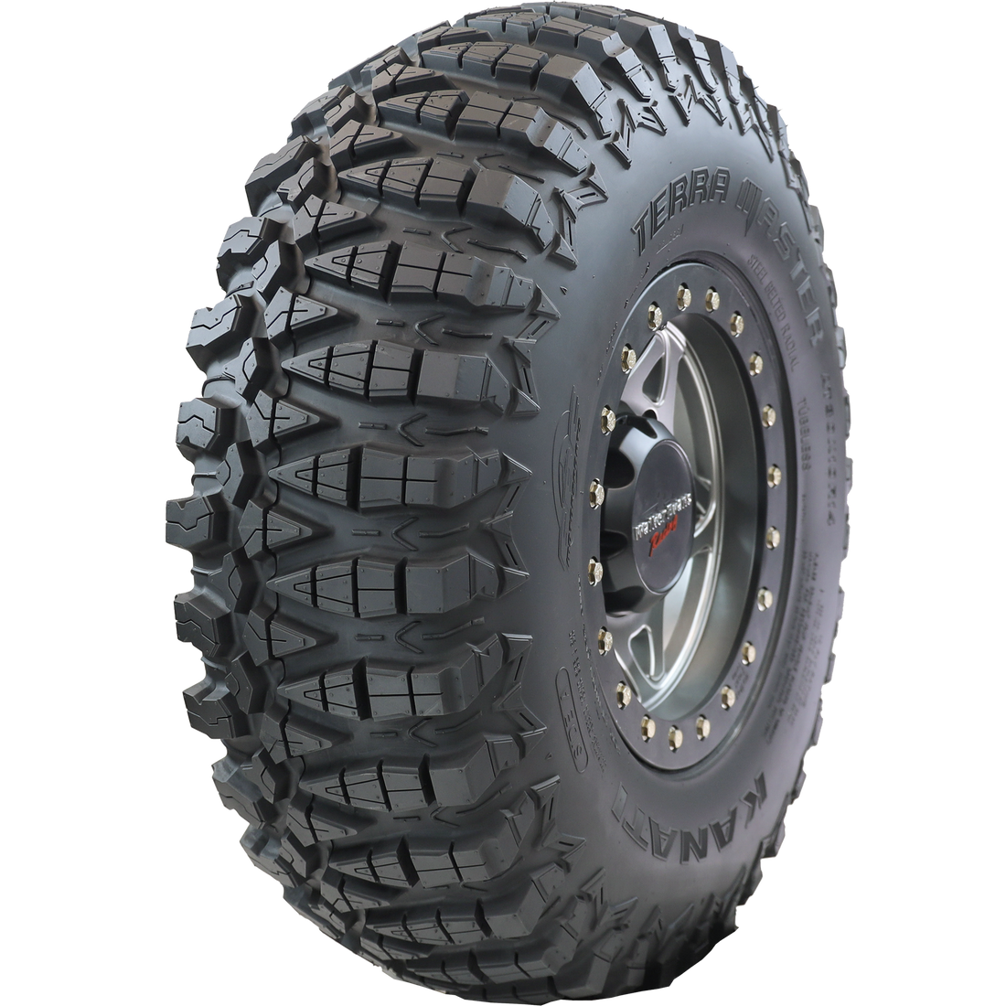 Angle view of Terra Master ATV/UTV tire, showing the tread, partial sidewall, and the rim. The image showcases the tire's profile optimized for fierce straight-line traction, and side bite offering greater control during cornering, ensuring a high-performance ride in varied terrains.