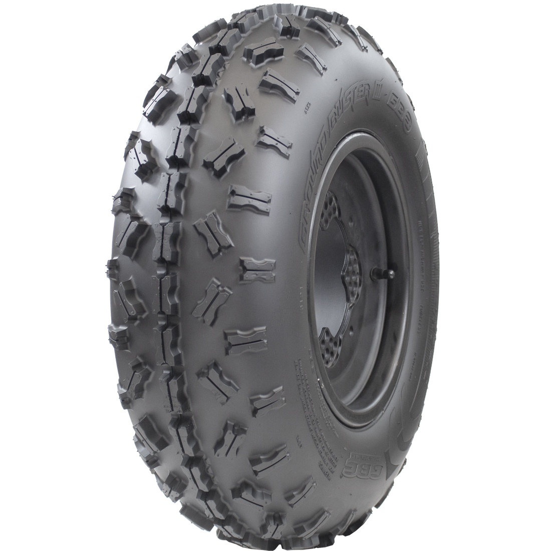 Angle view of Ground Buster III ATV Front tire, displaying the tread, a snippet of the sidewall, and the rim. The image demonstrates the tire's non-directional sipped X-knob tread pattern offering maximum flexibility